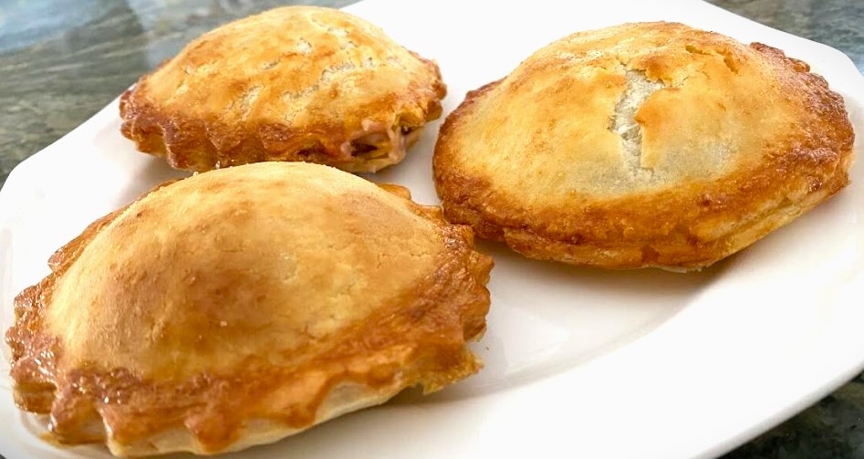 Original Empanoli hand pies arranged on a surface